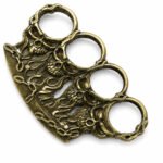 Brass knuckles bracelet with four-finger ring in the shape of a tiger fist and will-o'-the-wisp