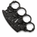 Brass knuckles bracelet with four-finger ring in the shape of a tiger fist and will-o'-the-wisp
